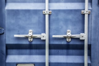 Blue metal door on a large shipping container.jpeg